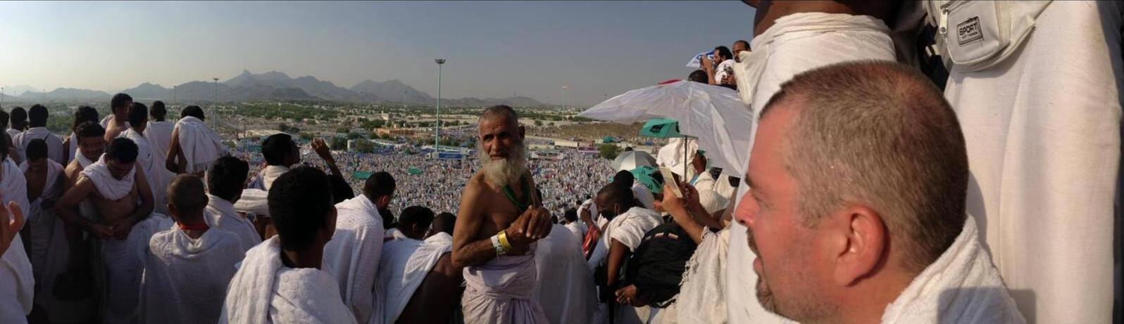 Omar at Hajj, standing among pilgrims on the plain of Arafat